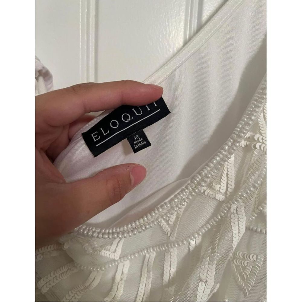One shoulder white jumpsuit from Eloquii.
Size 18
Beaded detail on top.
Purchase - Picture 7 of 11
